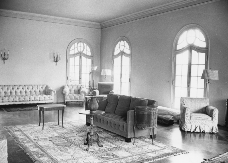 The interior of Le Petit Trianon includes this sitting room with windowed doors that open onto patios on three sides. Photo taken in 1959. Photographer unknown.