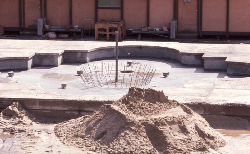 The large fountain, located in the center of campus near the Administration building, has quite a bit of work remaining before campus opens in Fall of 1967. 