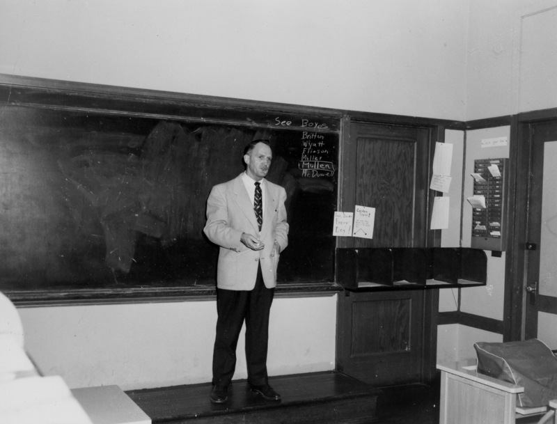 Cal Flint, first president of Foothill College, addresses faculty in 1960. This picture was taken in a classroom at the temporary location in Mountain View, which the college used for classes while the campus was being constructed in Los Altos Hills.