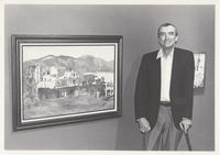Artist standing next to his painting.