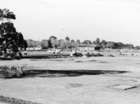 By 1966, the land had been cleared and construction of the college had begun. Near the center of the photo can be seen the winery building, which would later be home to the De Anza College Bookstore. It is now Financial Aid, Printing Services and adjunct faculty offices. 
