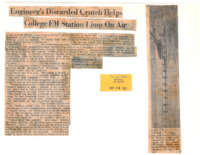 News article reporting on student Douglas M. Gardner's repair of the KFJC antenna on Black Mountain using an old crutch. The new signal is being studied by Foothill's electronic engineering division to decide whether the college should request a permit from the FCC to use a directional antenna. Photograph of Gardner on antenna with crutch.