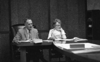 Dr. Calvin C. Flint and his secretary, Lorraine Anderson, attend a meeting of the Board of Trustees in the 1960s.