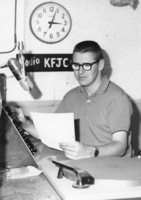 Unidentified student at the broadcast desk of KFJC in the basement of Foothill College in Mountain View. 