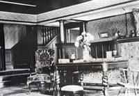 The living room of the Griffin House in 1908 shows the extensive use of California wood used for trim, paneling and staircase construction.