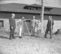 Members of the Board of Trustees stand in front of the Baldwin Winery building to survey the land prior to the construction of De Anza College. From left to right: A.P Christiansen, unknown surveyor, Hugh C. Jackson, Mary Lou Zoglin and Dr. Robert Smithwick.