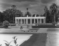 Le Petite Trianon is shown here in its original location on the land that would later become De Anza College. The rear of the building faces Stevens Creek Blvd., in a location that would  be occupied by the Flint Center for the Performing Arts. The Flint Center opened in 1971 and is scheduled for demolition in 2022. The swimming pool in the foreground later become a fountain in the Sunken Garden at De Anza.