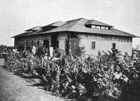 This image, taken in the late 1800s, shows the Beaulieu winery building which would later become De Anza College's original bookstore. The building now houses Financial Aid and faculty offices. 