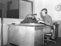 Bob Ballou, station manager, sits at the radio control panel in the basement of Foothill College in Mountain View. Photo from September 11, 1959 edition of Foothill Sentinel.