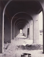 A view through some of the archways that have become iconic for De Anza College. These arches surround the swimming pool. This image was captured in 1966; the college opened in September of 1967.