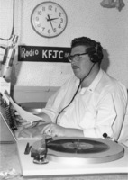 John Davis announcing at the broadcast desk of KFJC in the basement of Foothill College in Mountain View. 