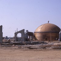 The planetarium dome at De Anza college is under construction in 1966. Archways, with no buildings yet attached, are springing up all over the campus. 