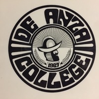 This De Anza College seal, no longer in use, was created by a local high school student and selected as the winner in a design contest. The  profile image in the center is Colonel Don Juan Bautista de Anza.