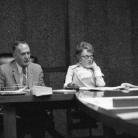 Dr. Calvin C. Flint and his secretary, Lorraine Anderson, attend a meeting of the Board of Trustees in the 1960s.