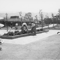 Landscapers are planting trees and shrubs as the finishing touches on the award winning design.