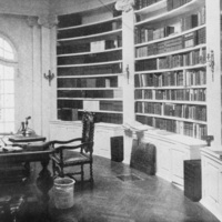 The stately library of Le Petit Trianon includes curved bookcases, a custom oak floor and beautiful hand crafted doors and windows. Photographer and date of photo unknown.