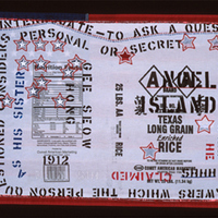 Rice sack sewn atop U.S. flag, embroidered and stenciled with phrases like 'made in USA' and 'Angel Island.'