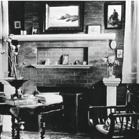 The living room of the Griffin House featured a large brick fireplace, which was the primary source of heat. Photo taken in 1908.
