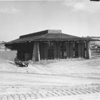 The original Foothill College Campus Center under construction.  To the right of the Campus Center is the iconic footbridge, and further right is the edge of the Men's Gym. Due to concerns regarding earthquake safety, the Campus Center and the footbridge would be demolished and replaced with new structures , completed in 2002.