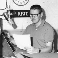 Unidentified student at the broadcast desk of KFJC in the basement of Foothill College in Mountain View. 