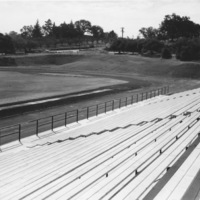 The football field, nearing construction, sits near the entrance to the college.