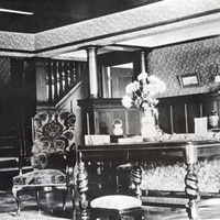 The living room of the Griffin House in 1908 shows the extensive use of California wood used for trim, paneling and staircase construction.
