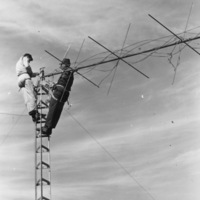 Two engineers finish rewiring the KFJC radio antenna on Black Mountain in this photograph from the October 12, 1962 issue of the Foothill Sentinel. Photograph by Jeanette Huston. 