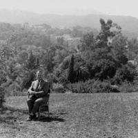 Calvin Flint sits in a classroom desk on the site of the future Foothill College. This photo was taken in 1958, just after the purchase of 122 acres of land in Los Altos Hills was completed. 