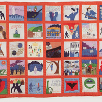 Rectangular quilt with 45 squares each depicting history. Orange fabric borders.