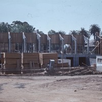 The arches of the Campus Center stand near the Baldwin Winery Building. These arches will eventually frame the exterior entrance to the Fireside Room.