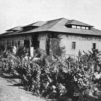 This image, taken in the late 1800s, shows the Beaulieu winery building which would later become De Anza College's original bookstore. The building now houses Financial Aid and faculty offices. 