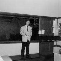 Cal Flint, first president of Foothill College, addresses faculty in 1960. This picture was taken in a classroom at the temporary location in Mountain View, which the college used for classes while the campus was being constructed in Los Altos Hills.