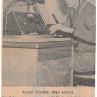Photograph of Bob Ballou at the KFJC broadcast desk preparing for an open house this evening at the station at Foothill College in mountain View. 