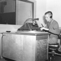 Bob Ballou, station manager, sits at the radio control panel in the basement of Foothill College in Mountain View. Photo from September 11, 1959 edition of Foothill Sentinel.