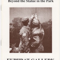 Sepia-toned photo of two veterans close together, each reaching up to touch a name on the Vietnam Veterans Memorial wall.