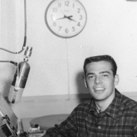 Unidentified student at the broadcast desk of KFJC in the basement of Foothill College in Mountain View. 